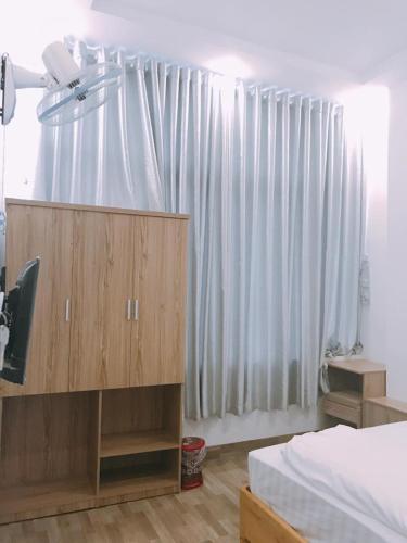 Postel nebo postele na pokoji v ubytování Anh Phat Hotel