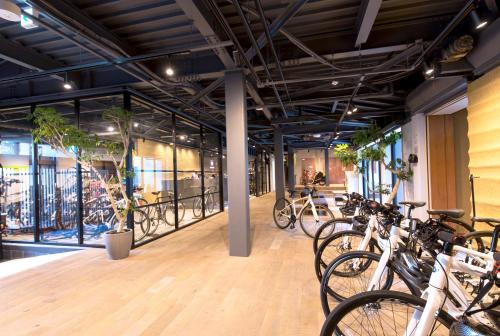 a room with a bunch of bikes parked in it at Kona Stay Bicycle Resort in Izunokuni