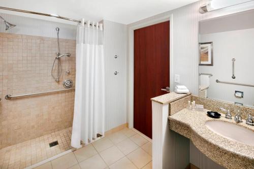 a bathroom with a sink and a shower at Courtyard Indianapolis Downtown in Indianapolis