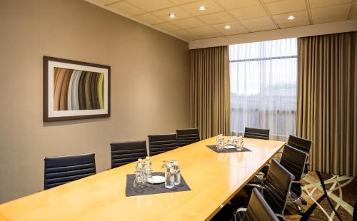 a conference room with a long table and chairs at Holiday Inn Express Vancouver-Metrotown (Burnaby) in Burnaby