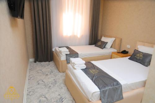Cama o camas de una habitación en Afsona Hotel