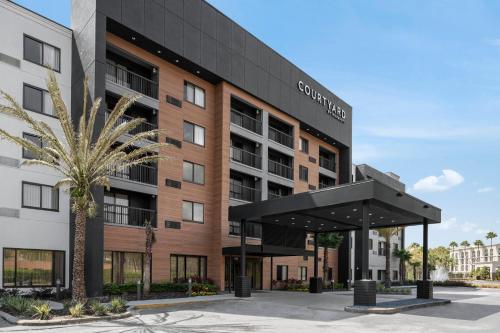 a rendering of the exterior of a building at Courtyard Jacksonville Butler Boulevard in Jacksonville