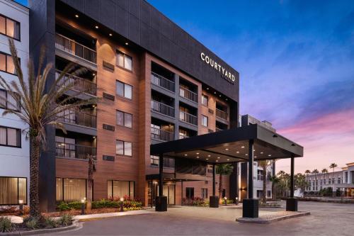 a rendering of a building with a building at Courtyard Jacksonville Butler Boulevard in Jacksonville