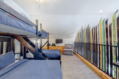 a room with a bunch of skis on a wall at Majestic Alpine Retreat in Taos Ski Valley
