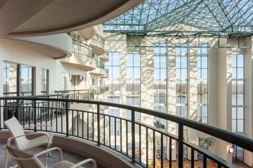a view from the second floor balcony of a building with chairs at Marriott Savannah Riverfront in Savannah