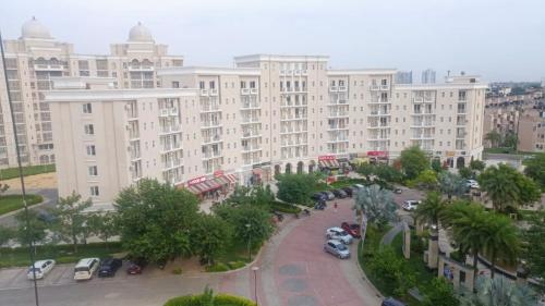 an aerial view of a large building with a parking lot at Lord Krishna Place in Vrindāvan