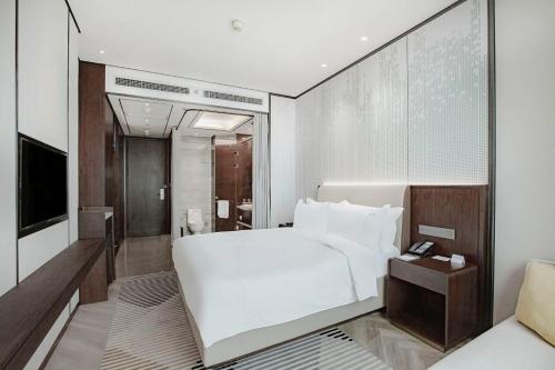 Postel nebo postele na pokoji v ubytování Holiday Inn Taiyuan City Center