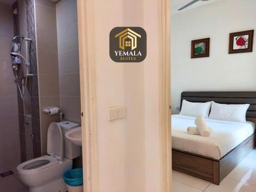 a room with a bed and a bathroom with a toilet at Yemala Suites at Skyloft - Johor in Johor Bahru