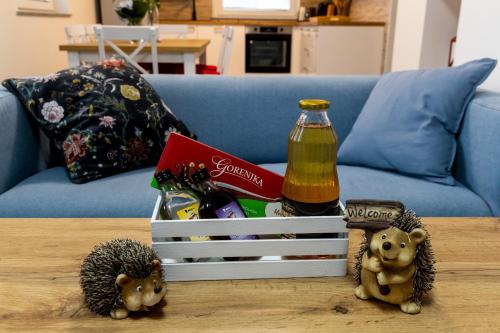 a table with a bottle of coke and toys on it at Aparthouse Jana Breg in Žirovnica