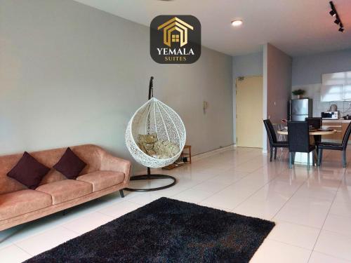 a living room with a couch and a swing at Yemala Suites at Skyloft - Johor in Johor Bahru