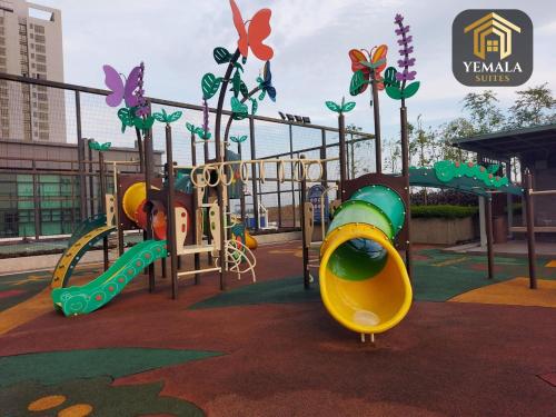 a playground with a slide in a park at Yemala Suites at Skyloft - Johor in Johor Bahru