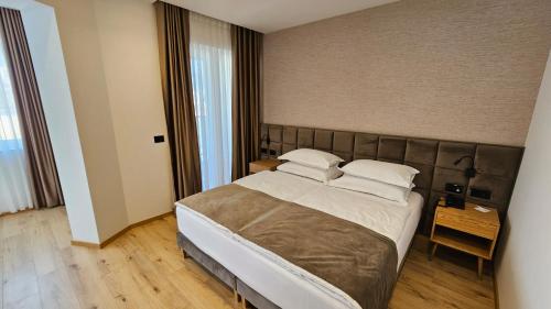 Voodi või voodid majutusasutuse SIBB Hotel toas