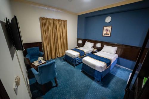 Postel nebo postele na pokoji v ubytování Al Barakah Mawaddah Hotel