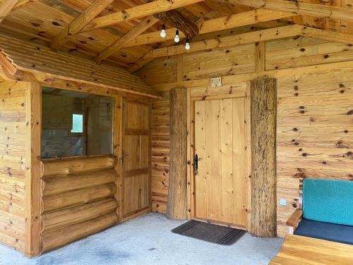 a wooden room with a door in a cabin at Vikendica Milošević in Arandjelovac