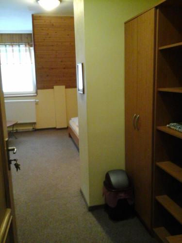 an empty room with a room with a window at Penzion Adam - Makov in Makov