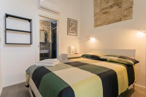 a bedroom with a large bed in a room at La Maddalena Suite & Rooms in Bitonto