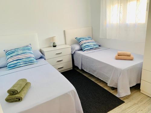 Ένα ή περισσότερα κρεβάτια σε δωμάτιο στο Apartamento Disfruta