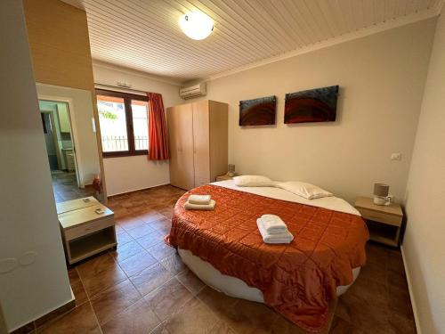 A bed or beds in a room at Lefkada Villas - Cheloni Villa Vafkeri