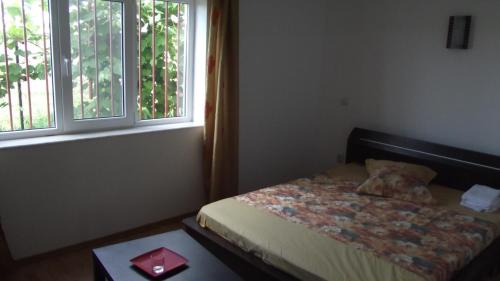 Un pat sau paturi într-o cameră la Vila Laura