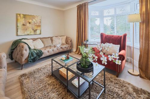 a living room with a couch and a table at Host & Stay - South Riggs in Bedlington