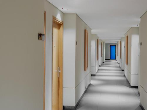 an empty corridor of a hospital hallway at Swiss-Belinn Timika in Timika