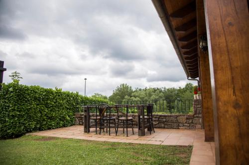 a table and chairs sitting on a patio at Apartamentos Els Ocells in Camprodon