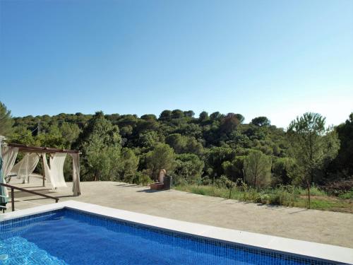 a swimming pool with a view of a mountain at CASA RURAL TRIGUEROS in Córdoba