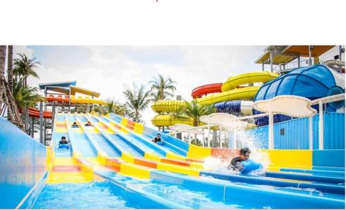 a water slide at a water park with people in it at Buenavista Estudio Torremolinos in Torremolinos