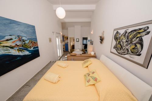 a living room with a bed and a couch at Julija Crnic in Barbat na Rabu