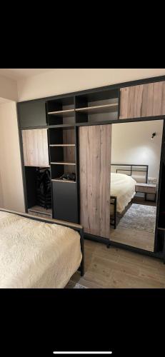 a bedroom with two beds and a large mirror at Apartment VR home hilly side in Tsaghkadzor