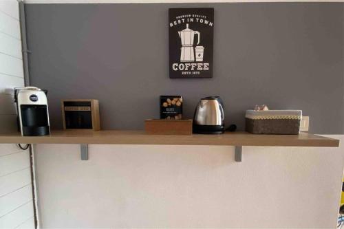 a shelf with various items on it in a kitchen at Casa Annais in zona Ospedale, Autodromo, parco in Monza