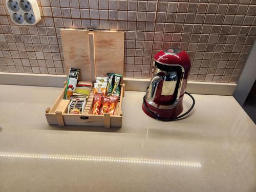 a toaster sitting on a counter next to a box of food at Villa Piano in Gebze