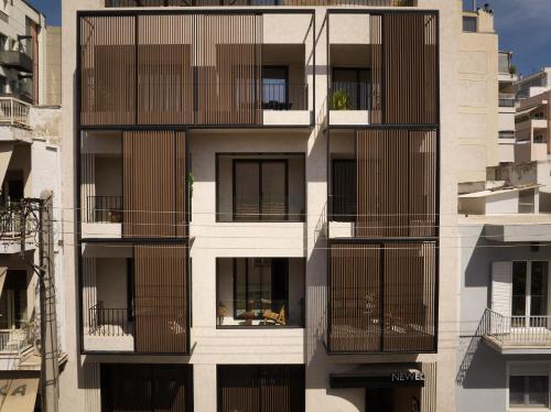 a building with balconies on the side of it at The Newel Psychiko in Athens
