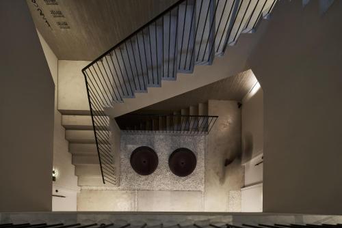 a spiral staircase with two chocolate donuts on it at The Newel Psychiko in Athens