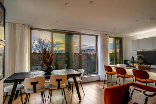 a kitchen and dining room with a table and chairs at The Castle Suite @ Ryedale House in York