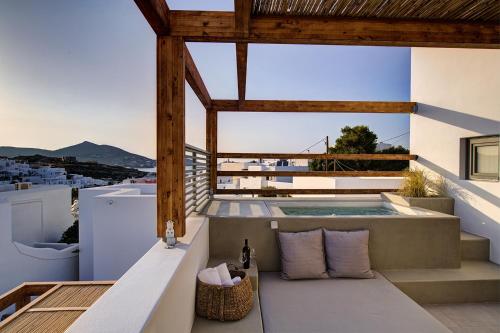 a view from the balcony of a house with a swimming pool at Clementina Paros in Naousa