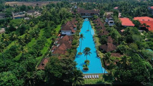 an aerial view of a resort with a swimming pool at Rhythm Kumarakom in Kumarakom