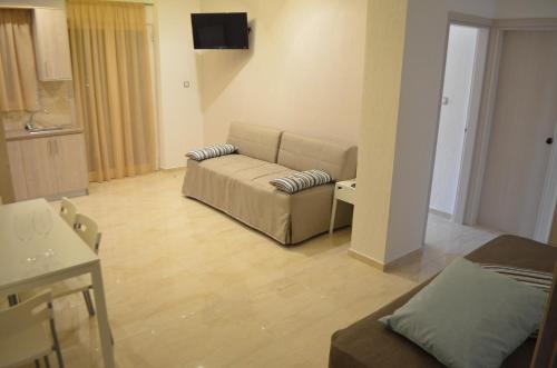A television and/or entertainment centre at Ammos Apartments