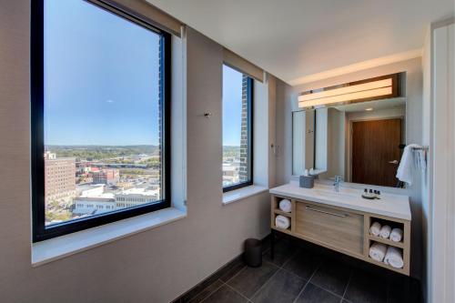 a bathroom with a sink and a large window at The Threefoot Hotel, Meridian, a Tribute Portfolio Hotel in Meridian