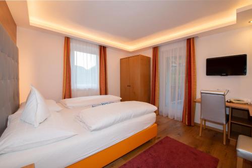 Postel nebo postele na pokoji v ubytování Ruster Resort