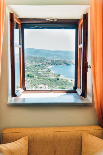 a window with a view of the ocean at The Traditional House of Molivos in Mithymna