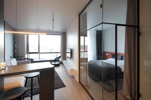 a room with a bed and a table and chairs at Old City Apartments in Lviv
