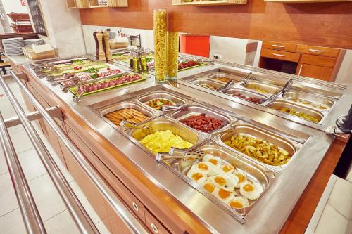 a buffet line with many different types of food at Boutique Central in Sibiu