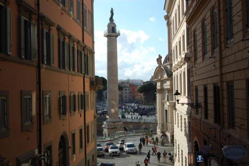 a view of a city street with a clock tower at Stradivari Suite Roma in Rome