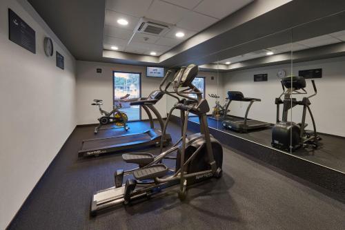 a gym with three tread machines in a room at City Express Plus by Marriott Ciudad de México Periférico Sur Tlalpan in Mexico City
