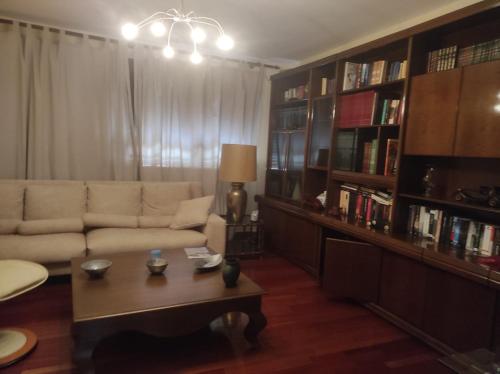 a living room with a couch and a coffee table at As pitas in Tapia de Casariego