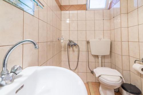 a bathroom with a shower with a toilet and a sink at Urban Apt Next University 5 in Heraklio Town
