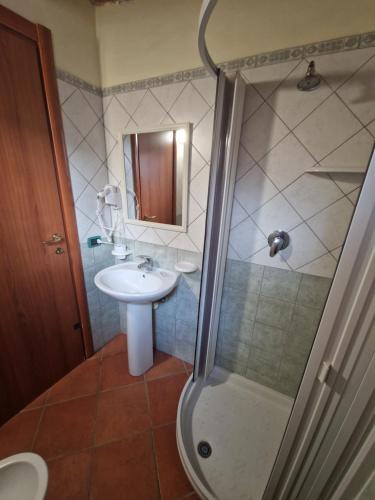 a bathroom with a sink and a shower at Monolocali in centro paese in Lampedusa