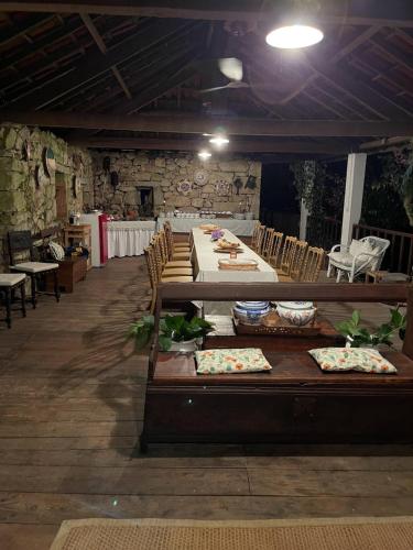 a dining room with a long table and chairs at Casa de Cerqueda in Celorico de Basto