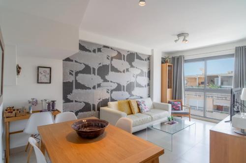 a living room with a couch and a table at Penthouse Mirador 5B Casasol in Nerja